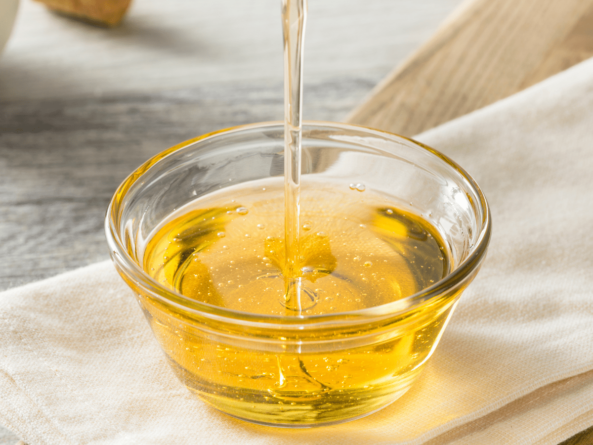 Drizzle of agave syrup into a small glass bowl. 