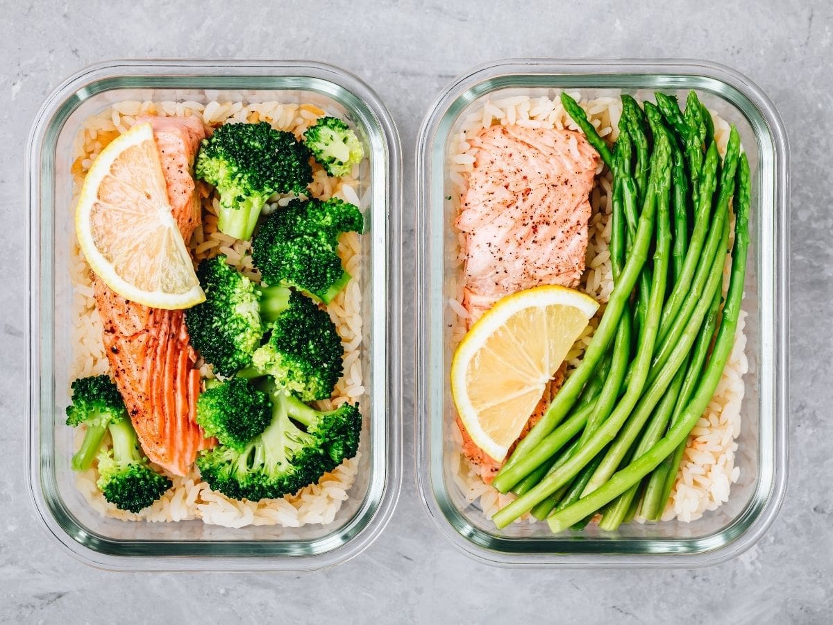Overhead shot of salmon, broccoli, and rice in glasslock containers.