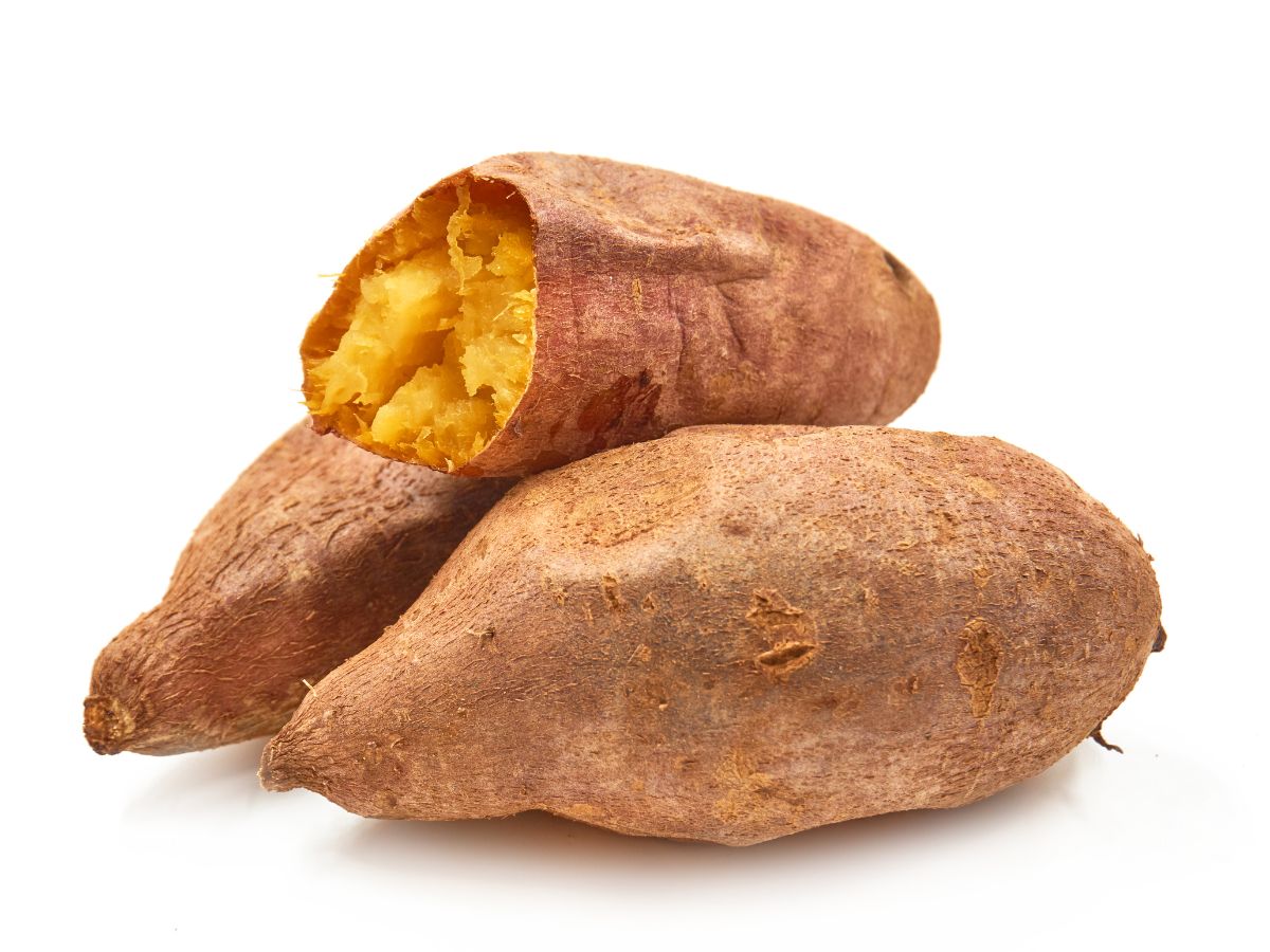 A spoiled sweet potato on a white background.