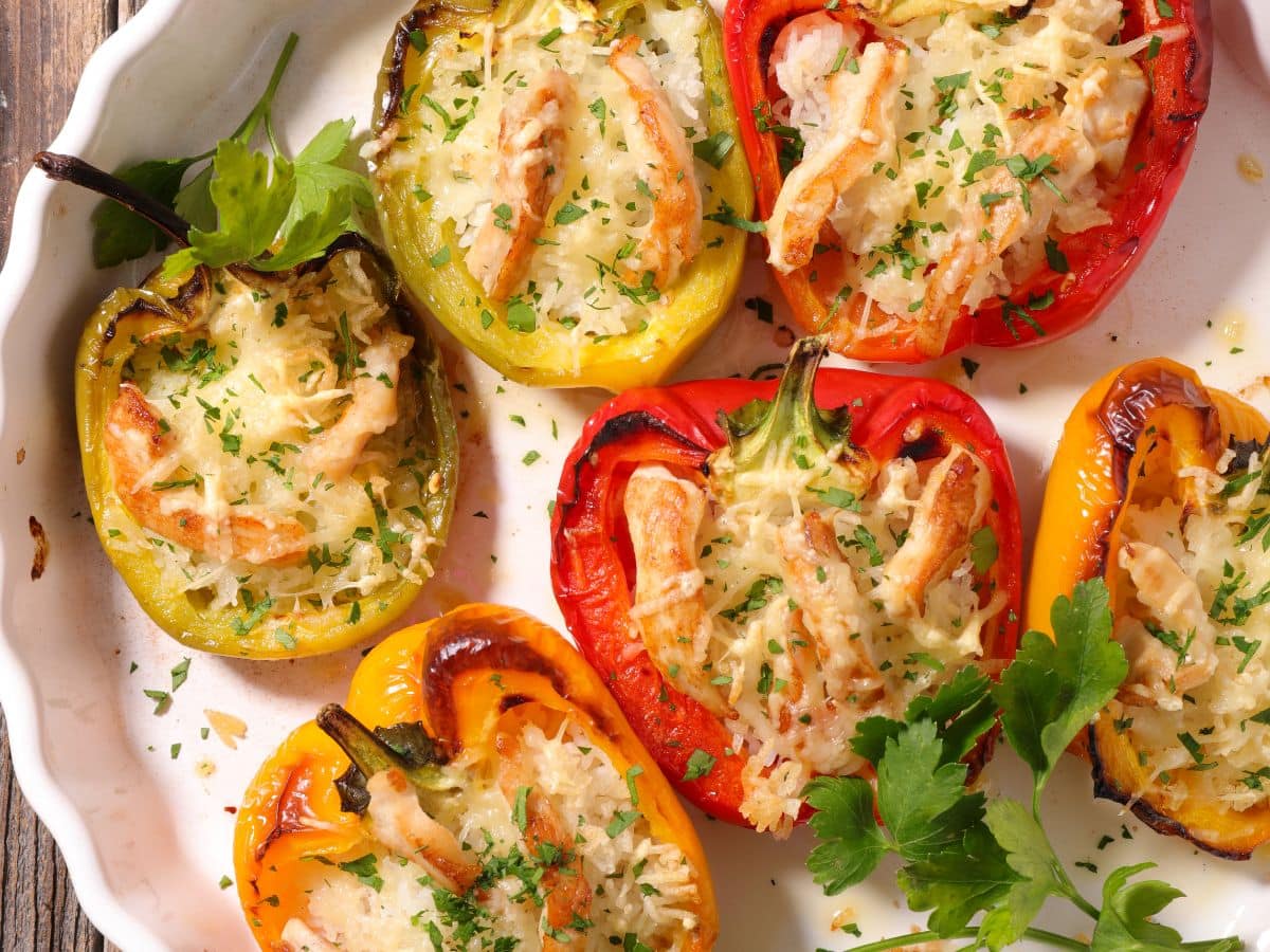 Stuffed bell peppers on a white plate.